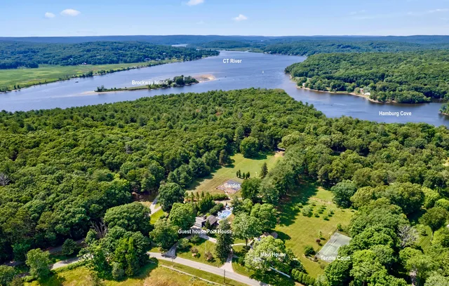 an aerial view of a houses with a yard
