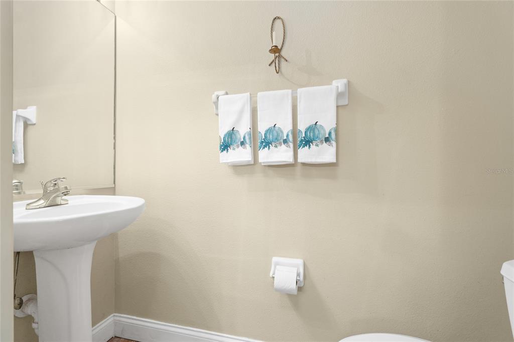 6216 Rosefinch Court, Unit 102 Lakewood Ranch, FL 34202 - Photo 11 of 45 a bathroom with a sink and a mirror