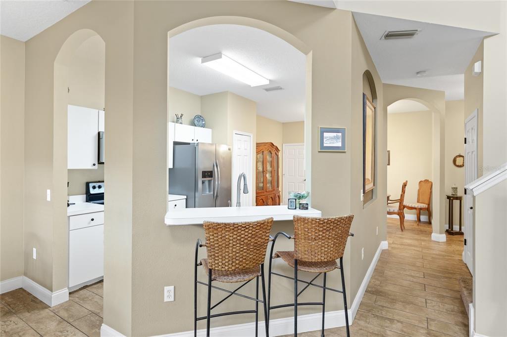 6216 Rosefinch Court, Unit 102 Lakewood Ranch, FL 34202 - Photo 14 of 45 a view of a dining room with furniture and wooden floor