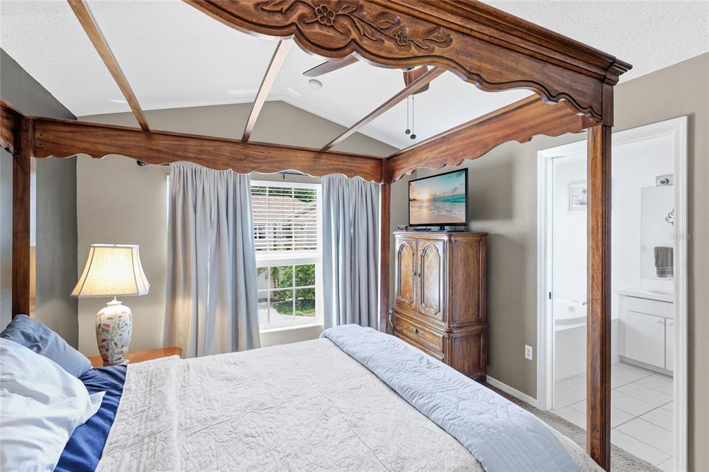 6216 Rosefinch Court, Unit 102 Lakewood Ranch, FL 34202 - Photo 17 of 45 a bedroom with a bed closet and a mirror