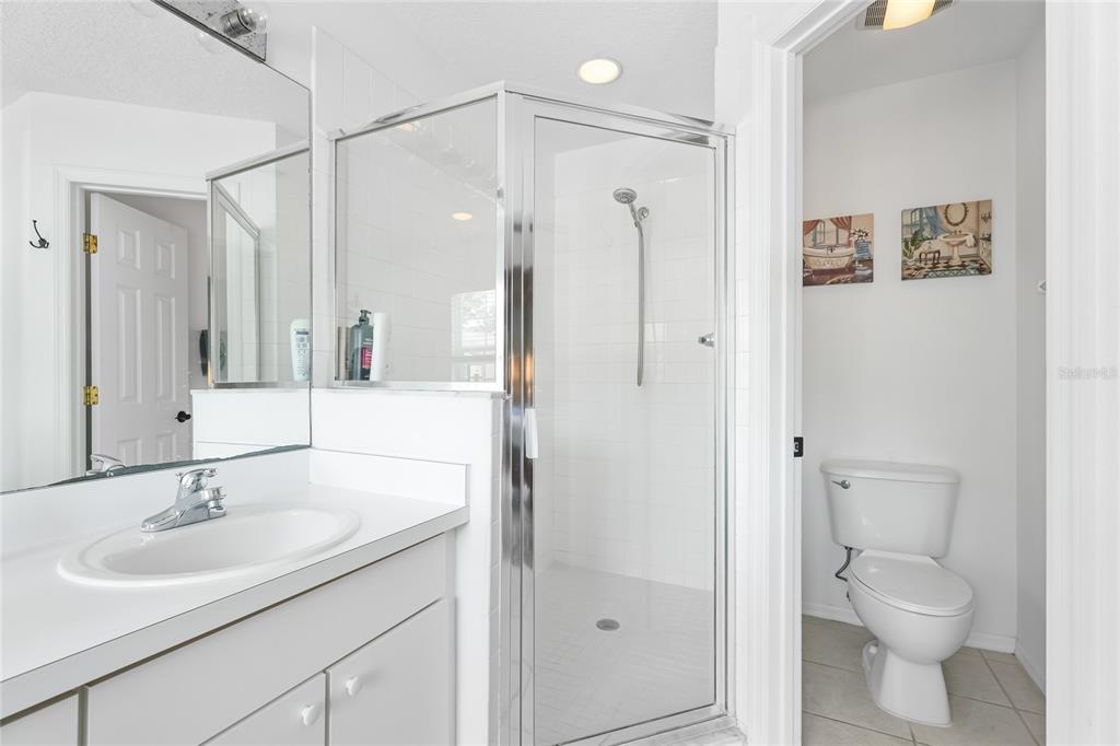 6216 Rosefinch Court, Unit 102 Lakewood Ranch, FL 34202 - Photo 19 of 45 a bathroom with a sink toilet and shower