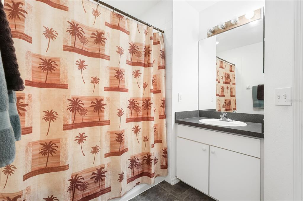 6216 Rosefinch Court, Unit 102 Lakewood Ranch, FL 34202 - Photo 24 of 45 a bathroom with a sink and a mirror