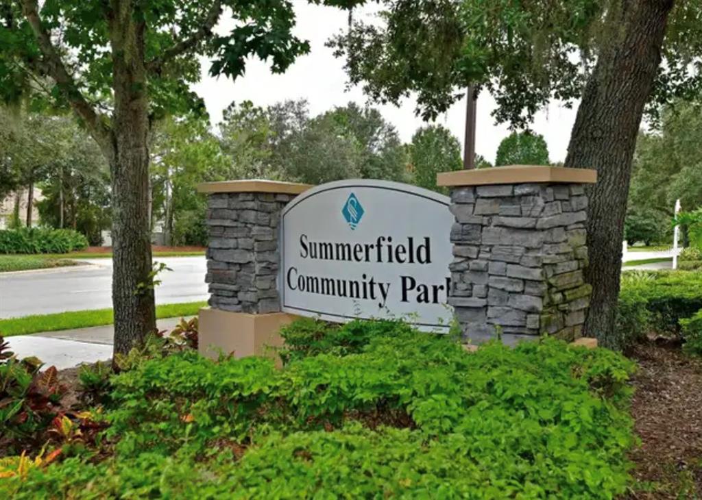 6216 Rosefinch Court, Unit 102 Lakewood Ranch, FL 34202 - Photo 29 of 45 a sign on the side of a road