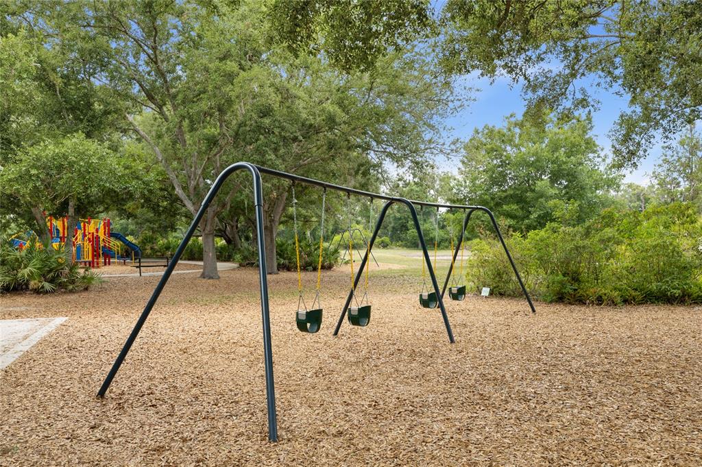 6216 Rosefinch Court, Unit 102 Lakewood Ranch, FL 34202 - Photo 38 of 45 a view of park with a slide
