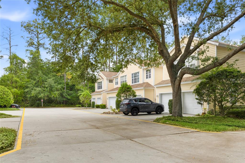 6216 Rosefinch Court, Unit 102 Lakewood Ranch, FL 34202 - Photo 4 of 45 a car parked in front of white house