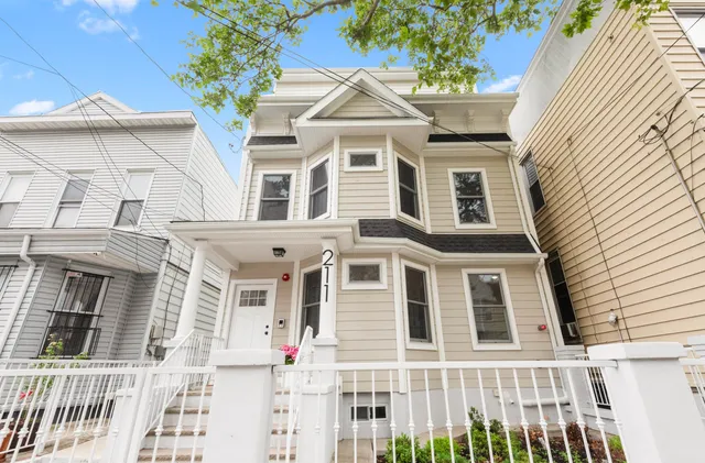 a front view of a multi story residential apartment building