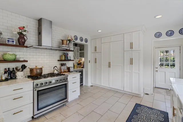 a kitchen with stainless steel appliances granite countertop a sink and cabinets