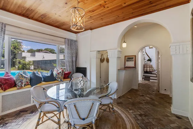 a dining room with furniture and window