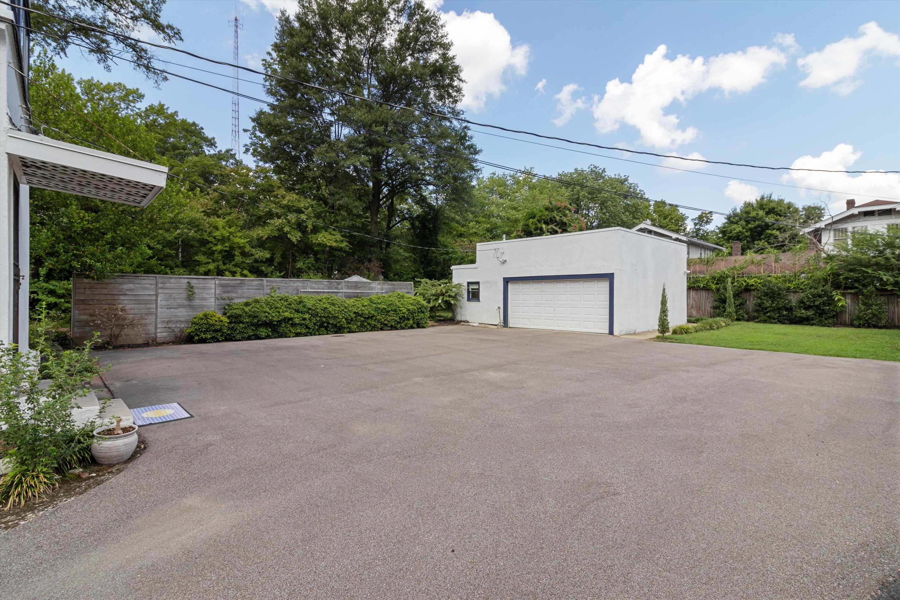 2346 North Strathmore Circle Memphis, TN 38112 - Photo 12 of 40 a view of a house with a yard and garage