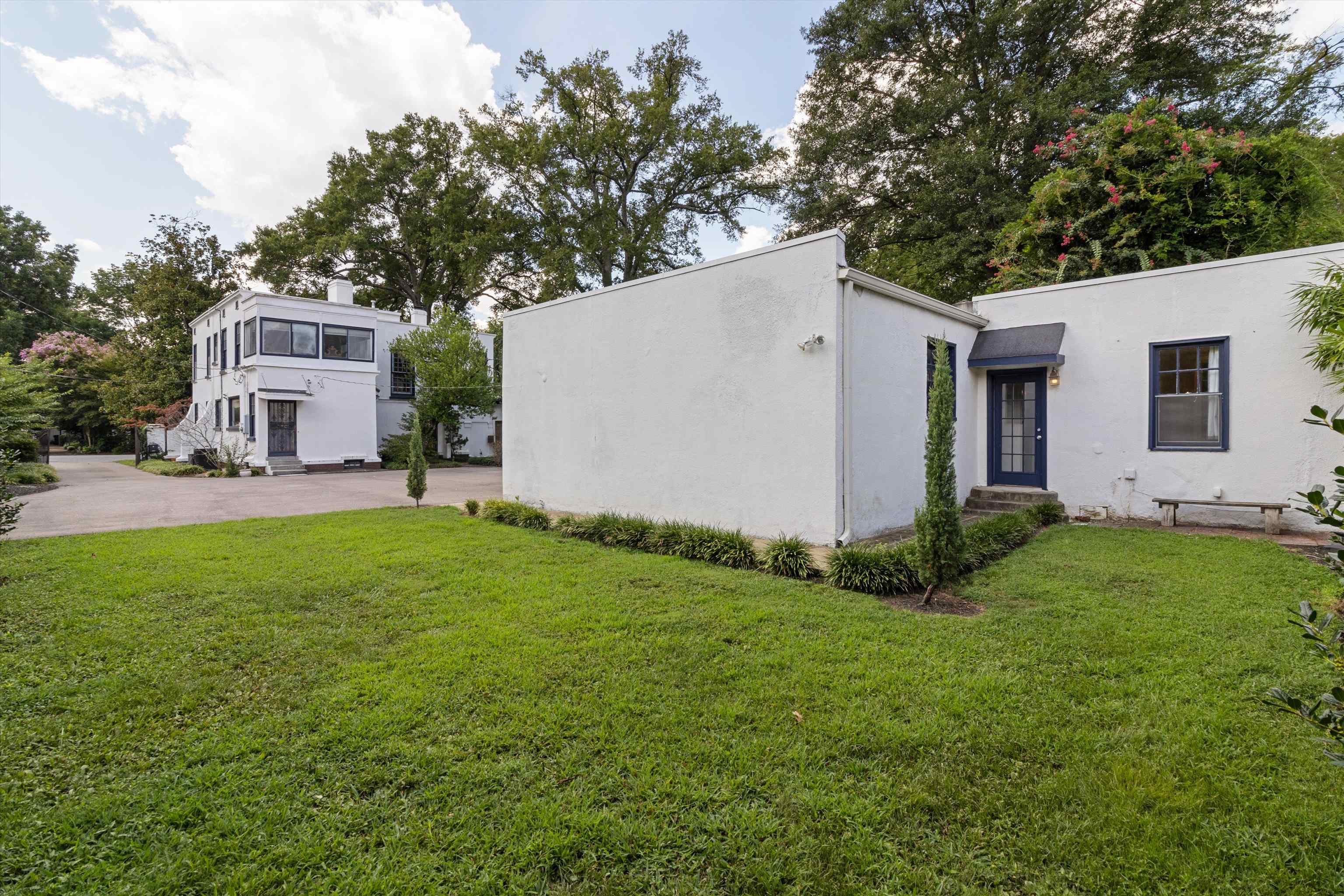 2346 North Strathmore Circle Memphis, TN 38112 - Photo 13 of 40 a view of a backyard with potted plants and large tree
