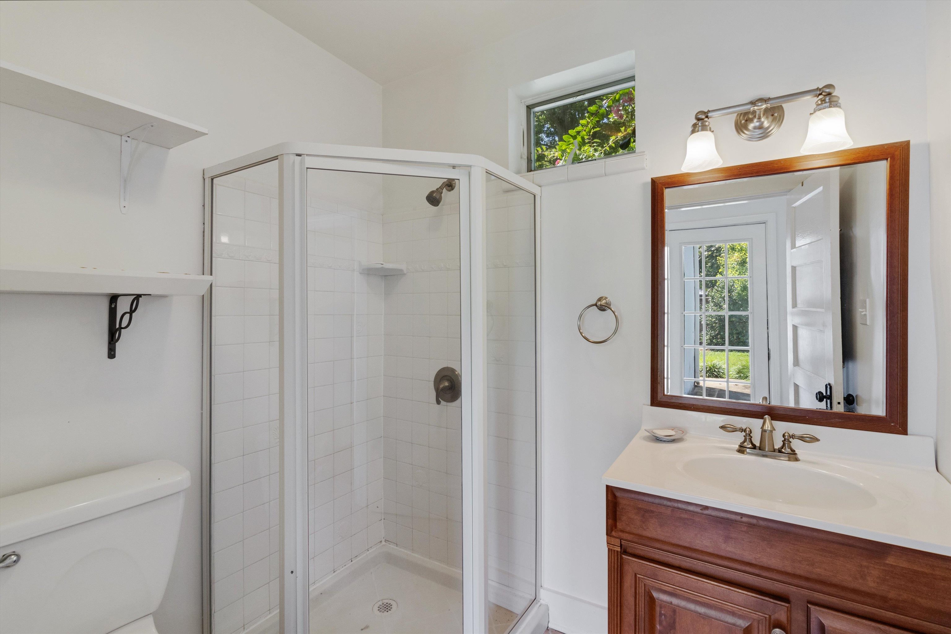 2346 North Strathmore Circle Memphis, TN 38112 - Photo 16 of 40 a bathroom with a sink a toilet and shower