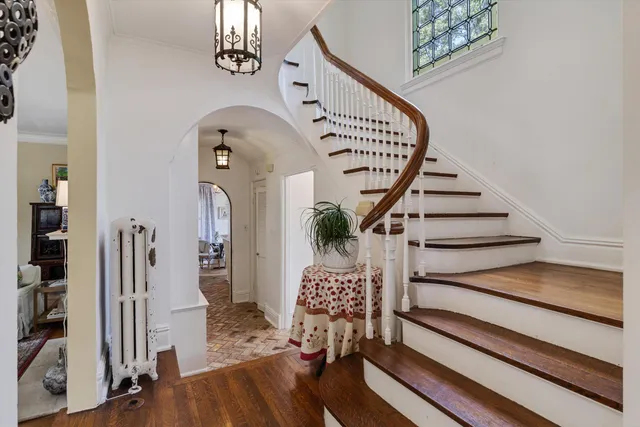 a view of entryway and hall with wooden floor