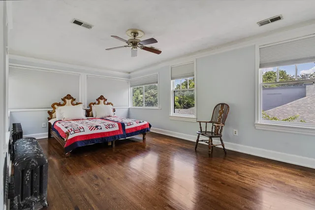 a bed room with furniture and a window