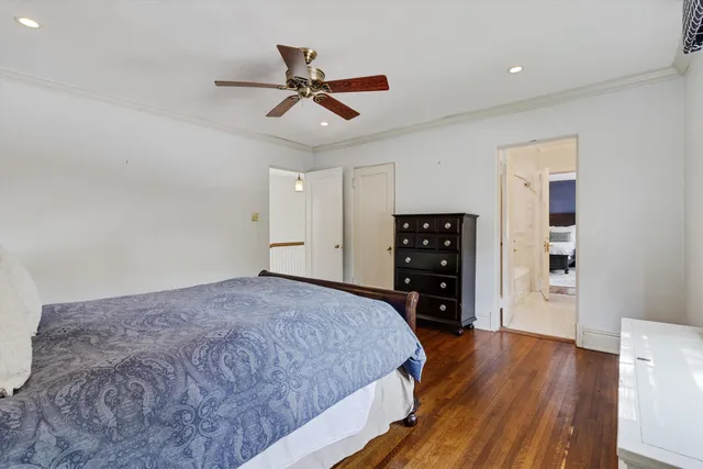 a spacious bedroom with a bed and a walk in closet