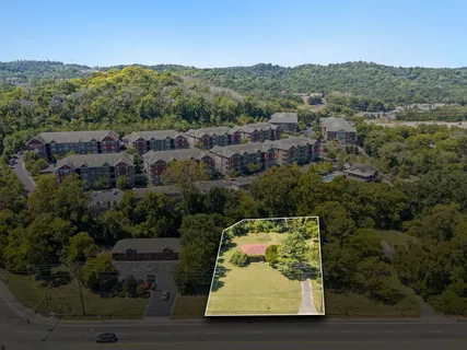 an aerial view of residential house and outdoor space