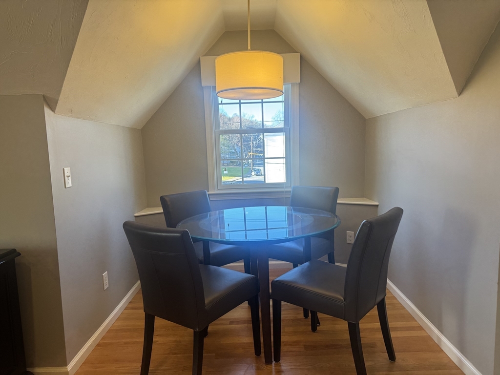 56 Eliot Street, Unit C Natick, MA 01760 - Photo 12 of 21 a view of a dining room with furniture and window