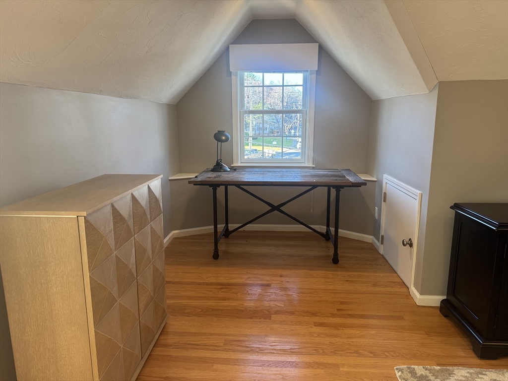 56 Eliot Street, Unit C Natick, MA 01760 - Photo 13 of 21 a view of a livingroom with furniture and a window