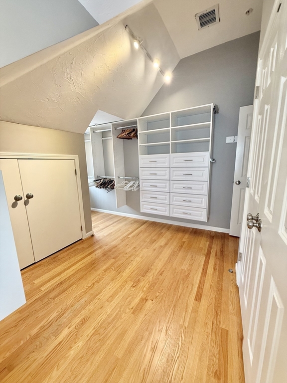 56 Eliot Street, Unit C Natick, MA 01760 - Photo 18 of 21 a view of empty room with wooden floor