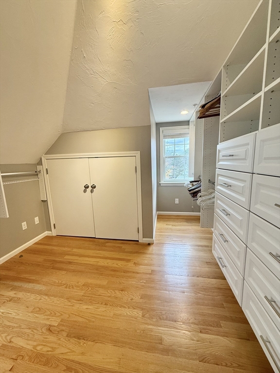 56 Eliot Street, Unit C Natick, MA 01760 - Photo 20 of 21 a view of a livingroom with wooden floor