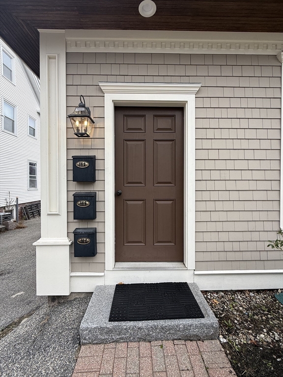 56 Eliot Street, Unit C Natick, MA 01760 - Photo 2 of 21 a view of a entryway door front of house