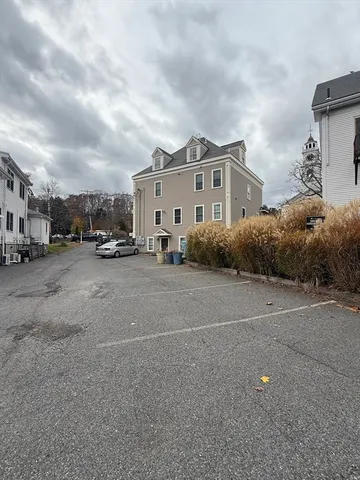 a view of street with parked cars