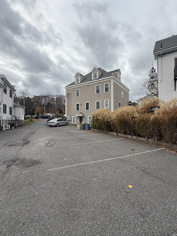 56 Eliot Street, Unit C Natick, MA 01760 - Photo 4 of 21 a view of street with parked cars