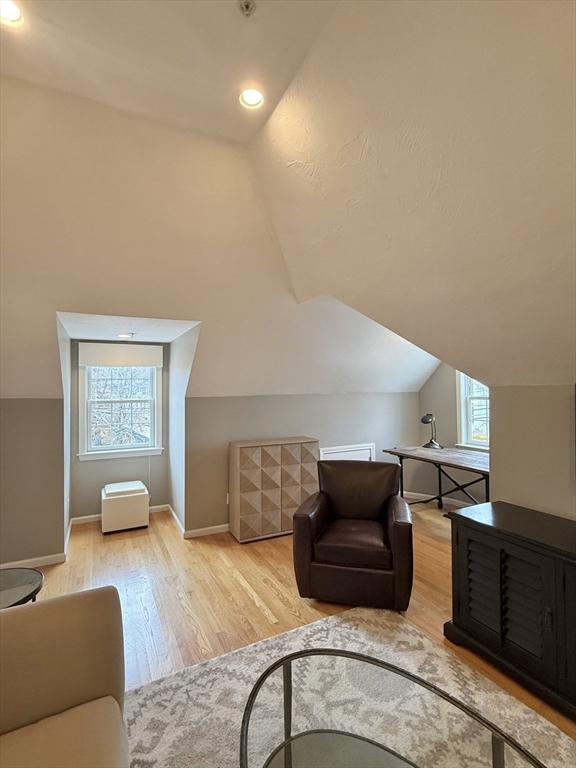 56 Eliot Street, Unit C Natick, MA 01760 - Photo 9 of 21 a living room with furniture and a couch