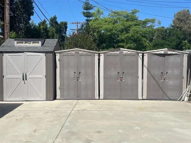 a view of a pathway of a house with a yard