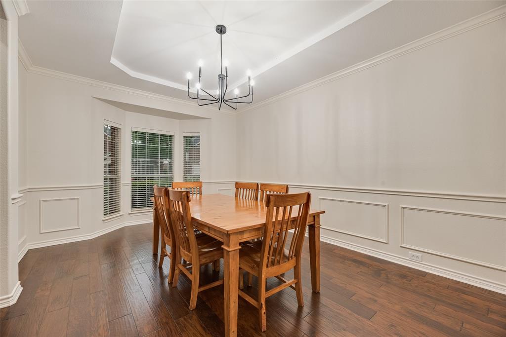 11920 Vienna Apple Road Fort Worth, TX 76244 - Photo 9 of 40 Dining room with hardwood floors, fresh paint and tiered ceiling at 11920 Vienna Apple in Villages of Woodland Springs community in North Fort Worth