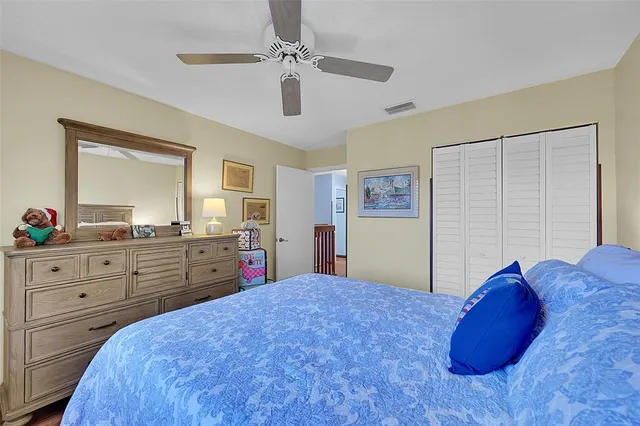 a bed room with a bed and a dresser