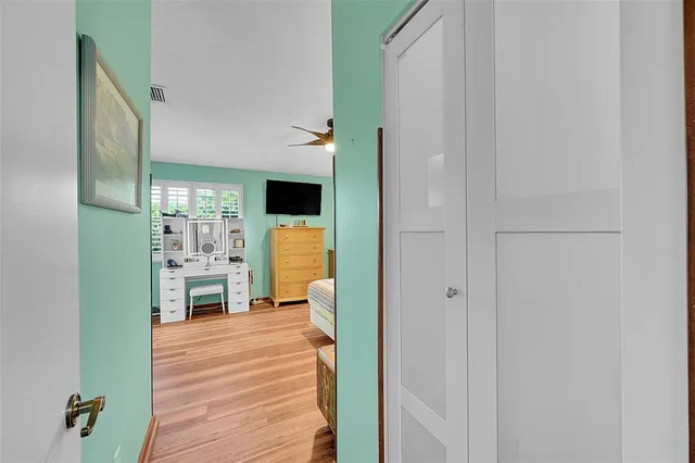 a view of kitchen with furniture and wooden floor