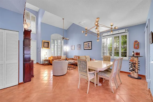 a dining room with furniture and window