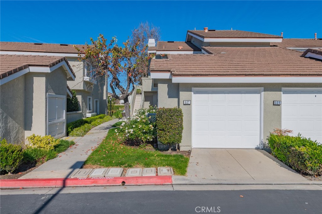 527 Springbrook North Irvine, CA 92614 - Photo 1 of 24 front view of house with potted plants