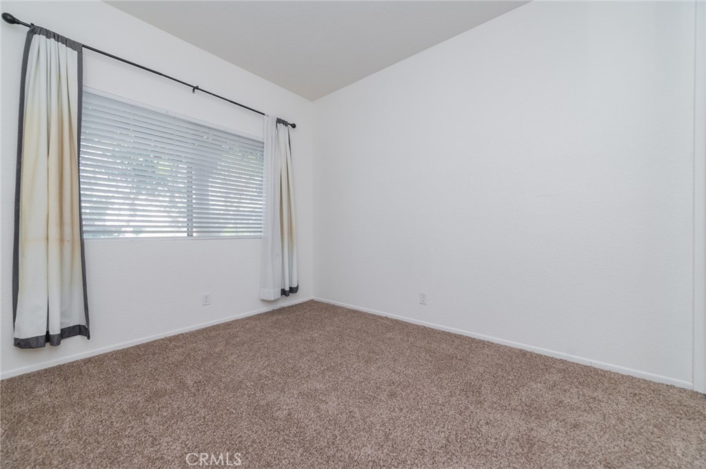 527 Springbrook North Irvine, CA 92614 - Photo 14 of 24 a view of an empty room with a window