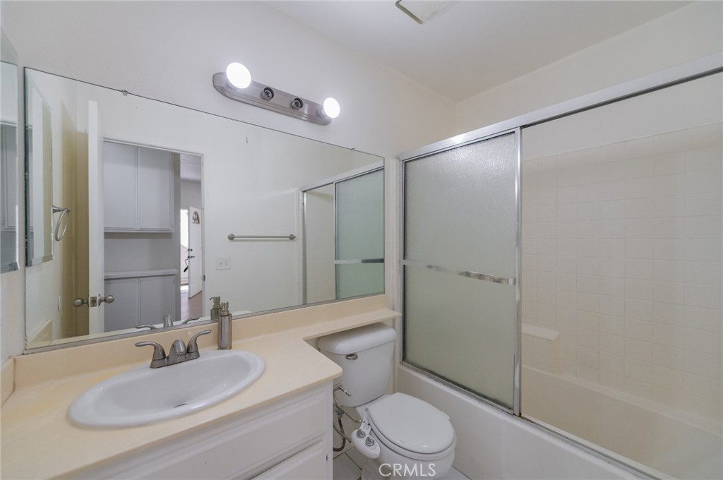 527 Springbrook North Irvine, CA 92614 - Photo 16 of 24 a bathroom with a sink a toilet and shower