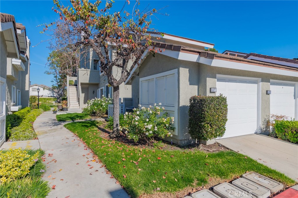 527 Springbrook North Irvine, CA 92614 - Photo 2 of 24 a front view of house with garden