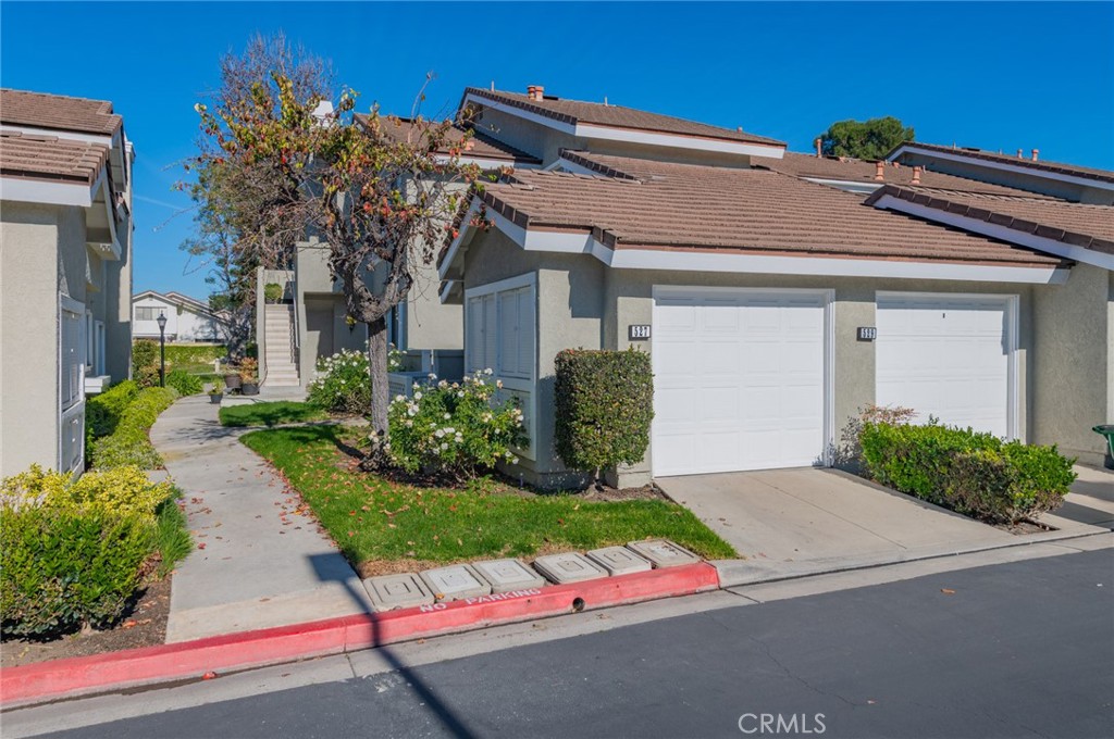 527 Springbrook North Irvine, CA 92614 - Photo 24 of 24 a front view of a house with a yard