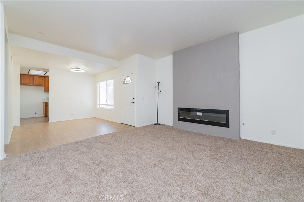 527 Springbrook North Irvine, CA 92614 - Photo 4 of 24 a view of an empty room with a fireplace