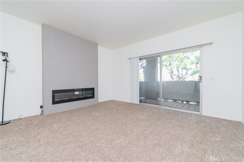 527 Springbrook North Irvine, CA 92614 - Photo 6 of 24 an empty room with windows