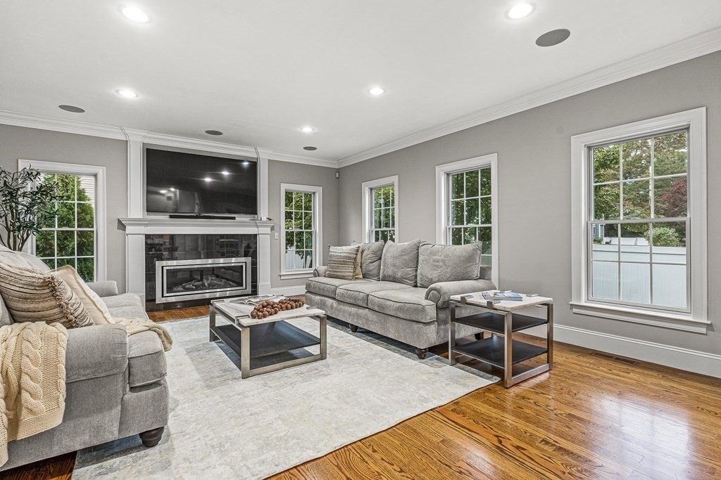 7 Pinevale Avenue Wellesley, MA 02482 - Photo 16 of 34 a living room with furniture a flat screen tv and a fireplace