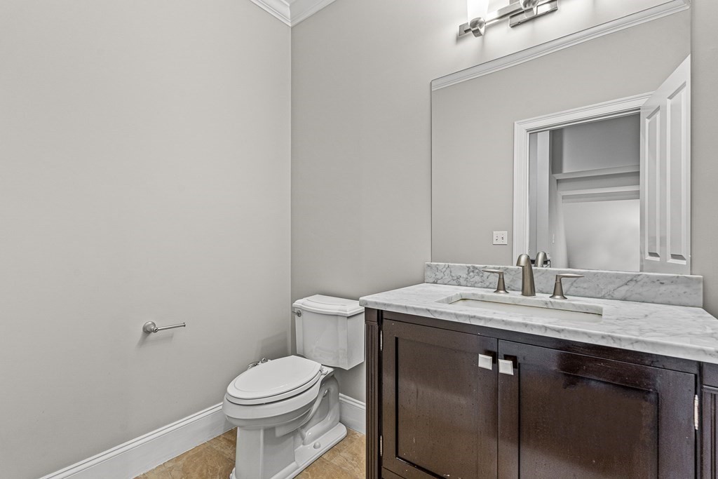 7 Pinevale Avenue Wellesley, MA 02482 - Photo 22 of 34 a bathroom with a sink a toilet and mirror