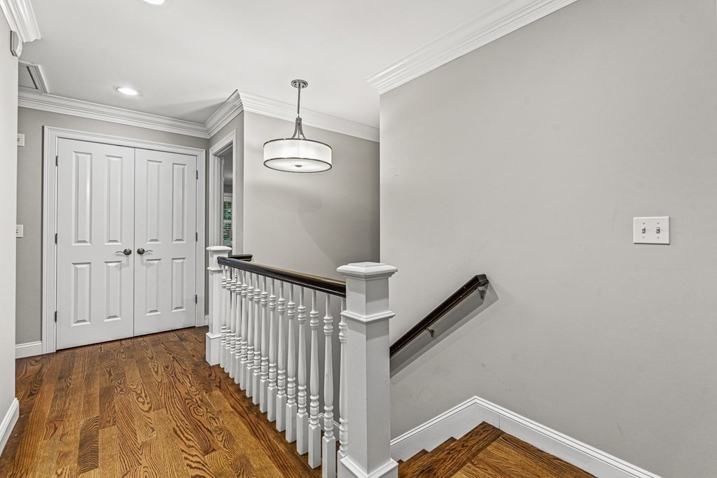 7 Pinevale Avenue Wellesley, MA 02482 - Photo 23 of 34 a view of a hallway with wooden floor and staircase