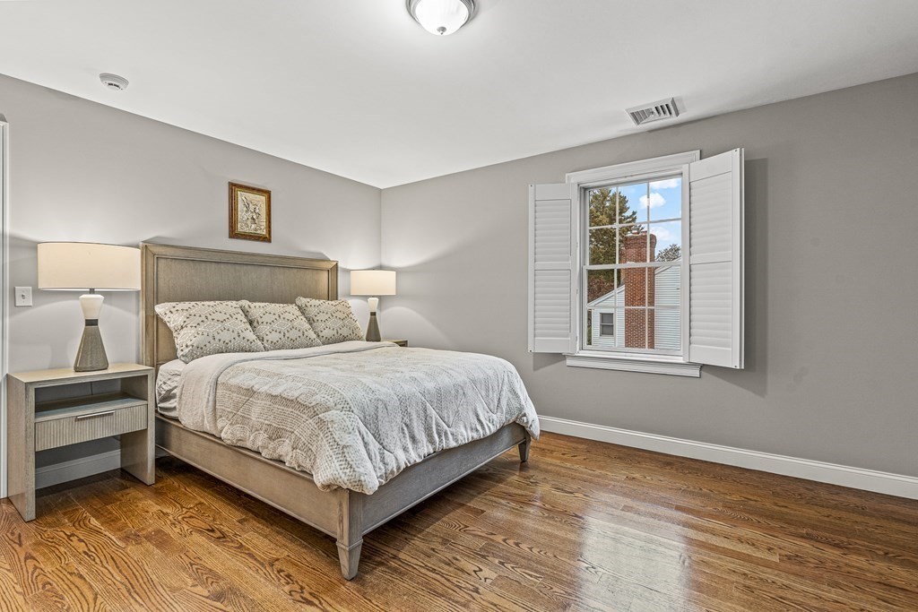 7 Pinevale Avenue Wellesley, MA 02482 - Photo 28 of 34 a bed sitting in a bedroom next to a window