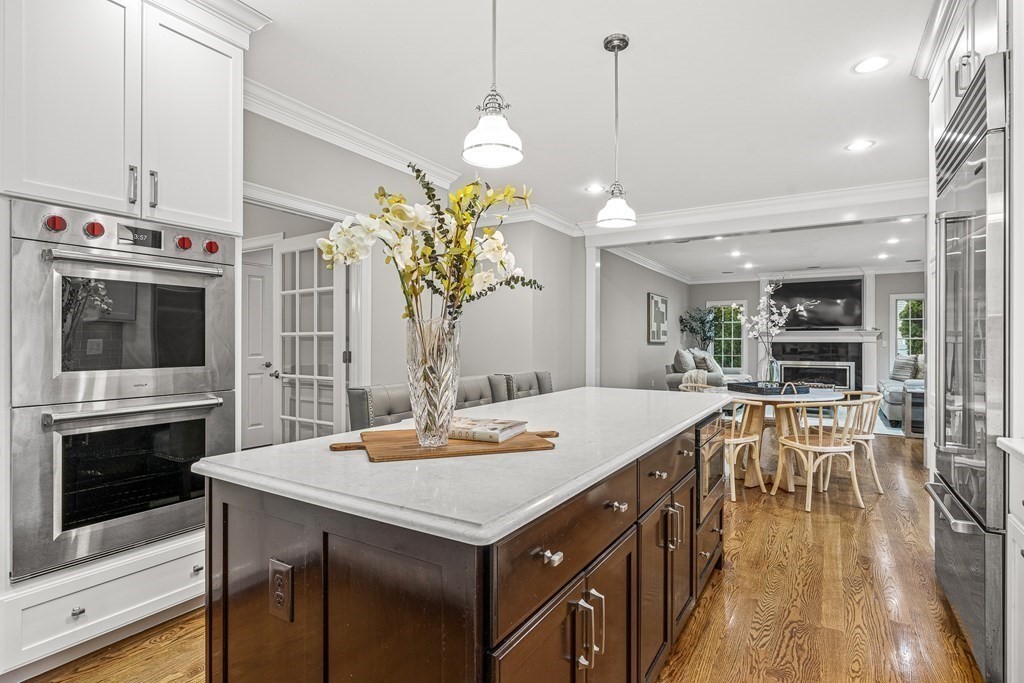 7 Pinevale Avenue Wellesley, MA 02482 - Photo 9 of 34 a open kitchen with a table and chairs in it