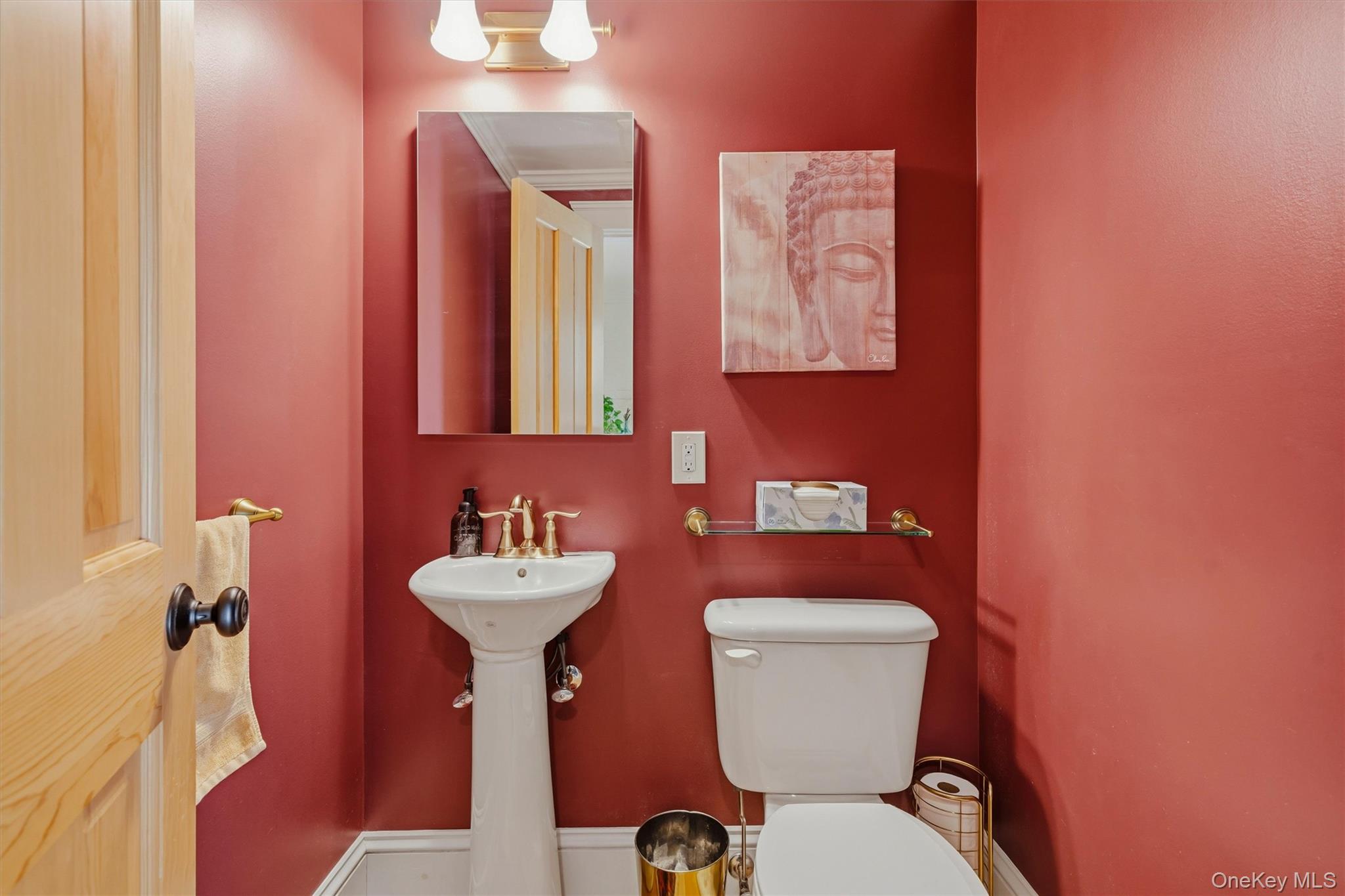 324 Haverstraw Road Suffern, NY 10901 - Photo 10 of 50 a bathroom with a toilet sink and mirror