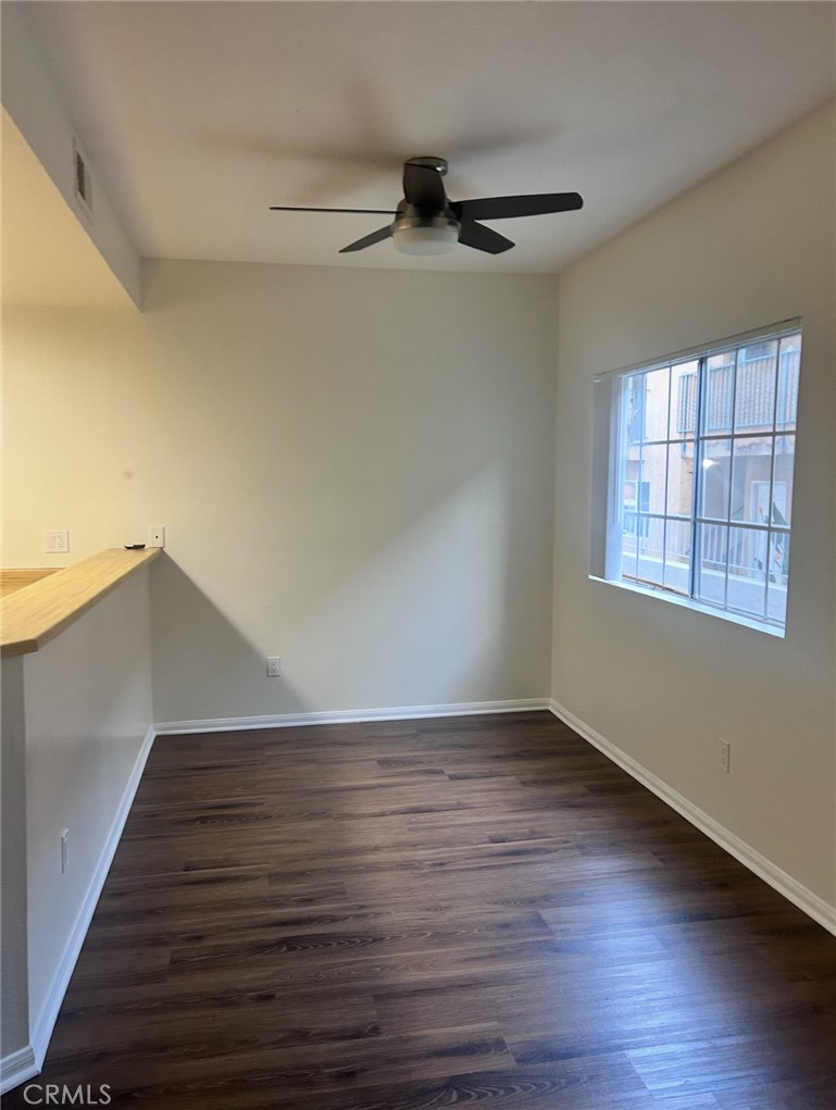 14448 Benefit Street, Unit 2 Sherman Oaks, CA 91423 - Photo 4 of 8 a view of an empty room with wooden floor and a window