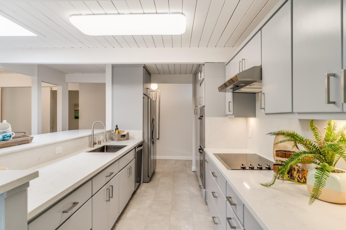 3924 Louis Road Palo Alto, CA 94303 - Photo 12 of 37 a kitchen with a sink stove and refrigerator