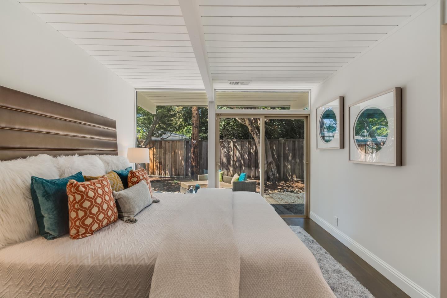 3924 Louis Road Palo Alto, CA 94303 - Photo 21 of 37 a bedroom with furniture and a large window