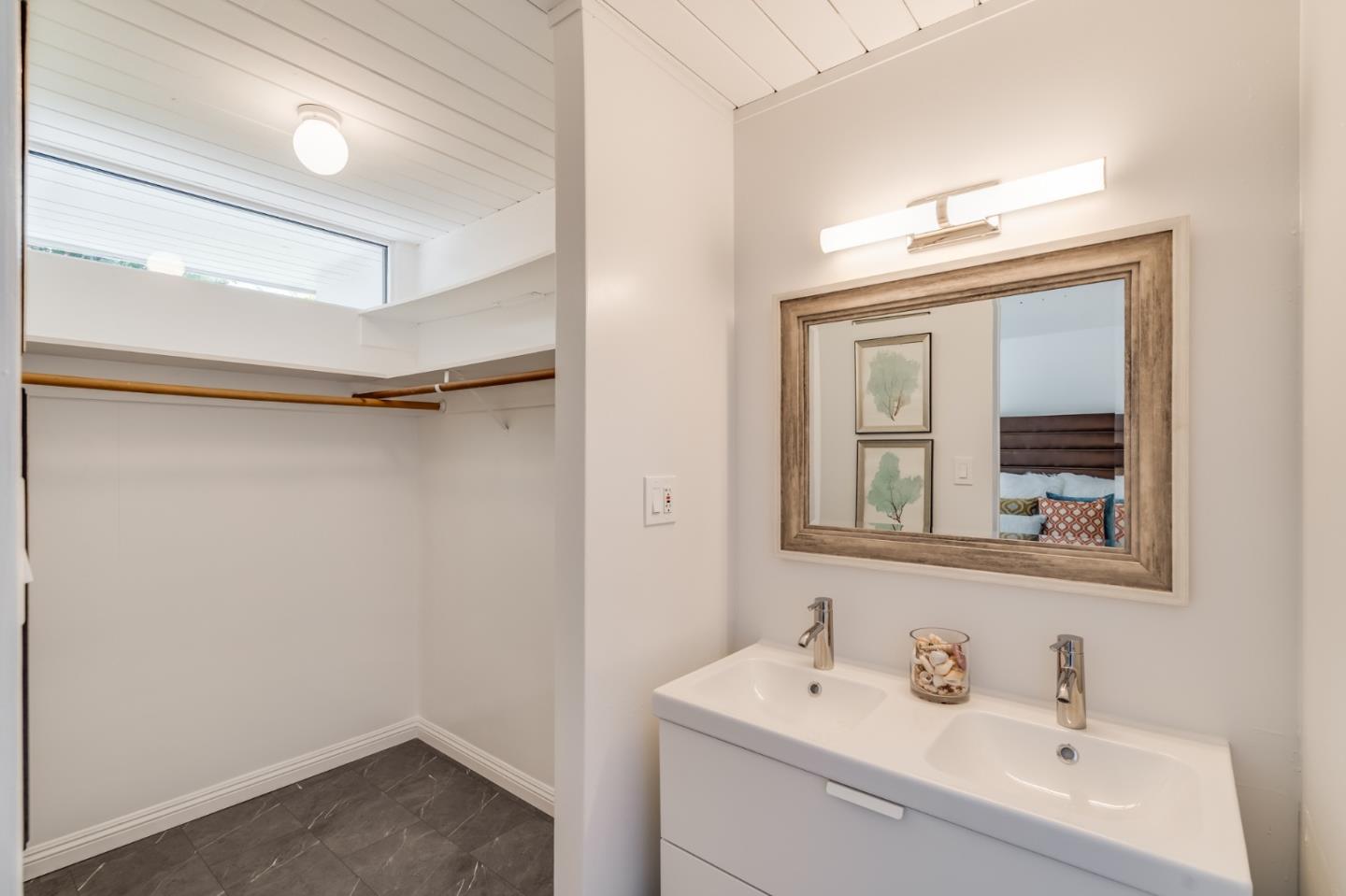 3924 Louis Road Palo Alto, CA 94303 - Photo 22 of 37 a bathroom with a sink mirror and vanity