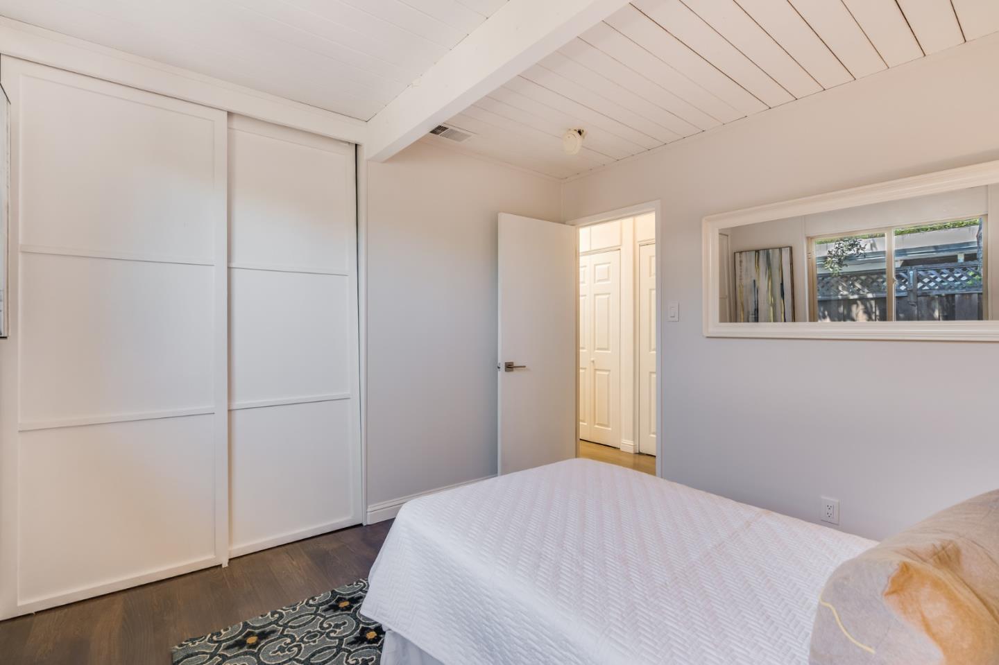 3924 Louis Road Palo Alto, CA 94303 - Photo 29 of 37 a bedroom with a bed and a window